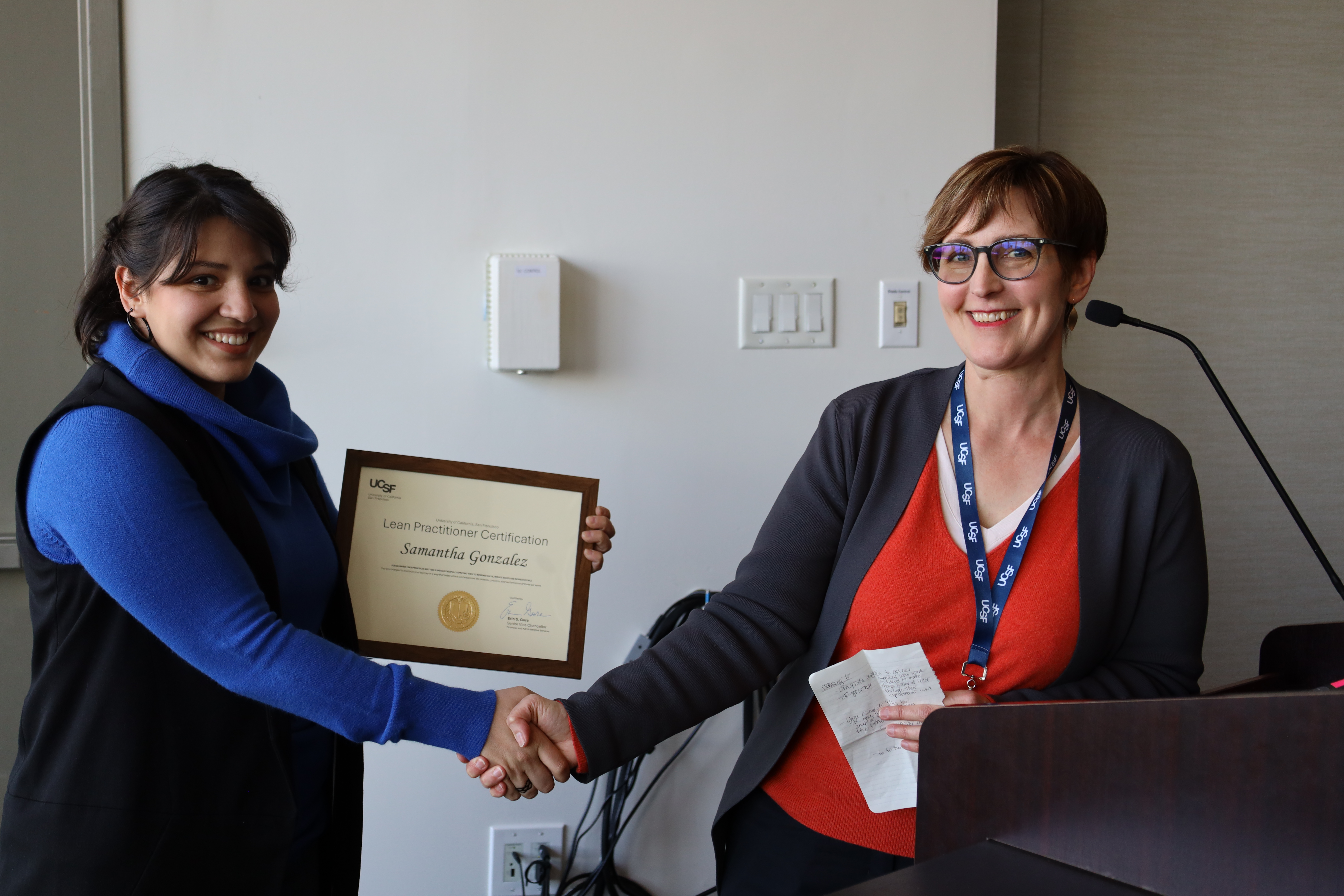 Sami Gonzalez receiving her Lean Practitioner Certificate for her project "Junior Specialist Onboarding"